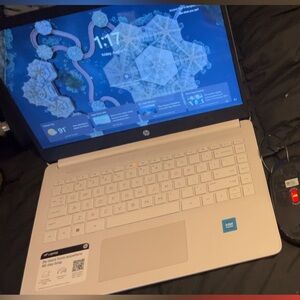 HP Silver Laptop with Black and Red Accessories